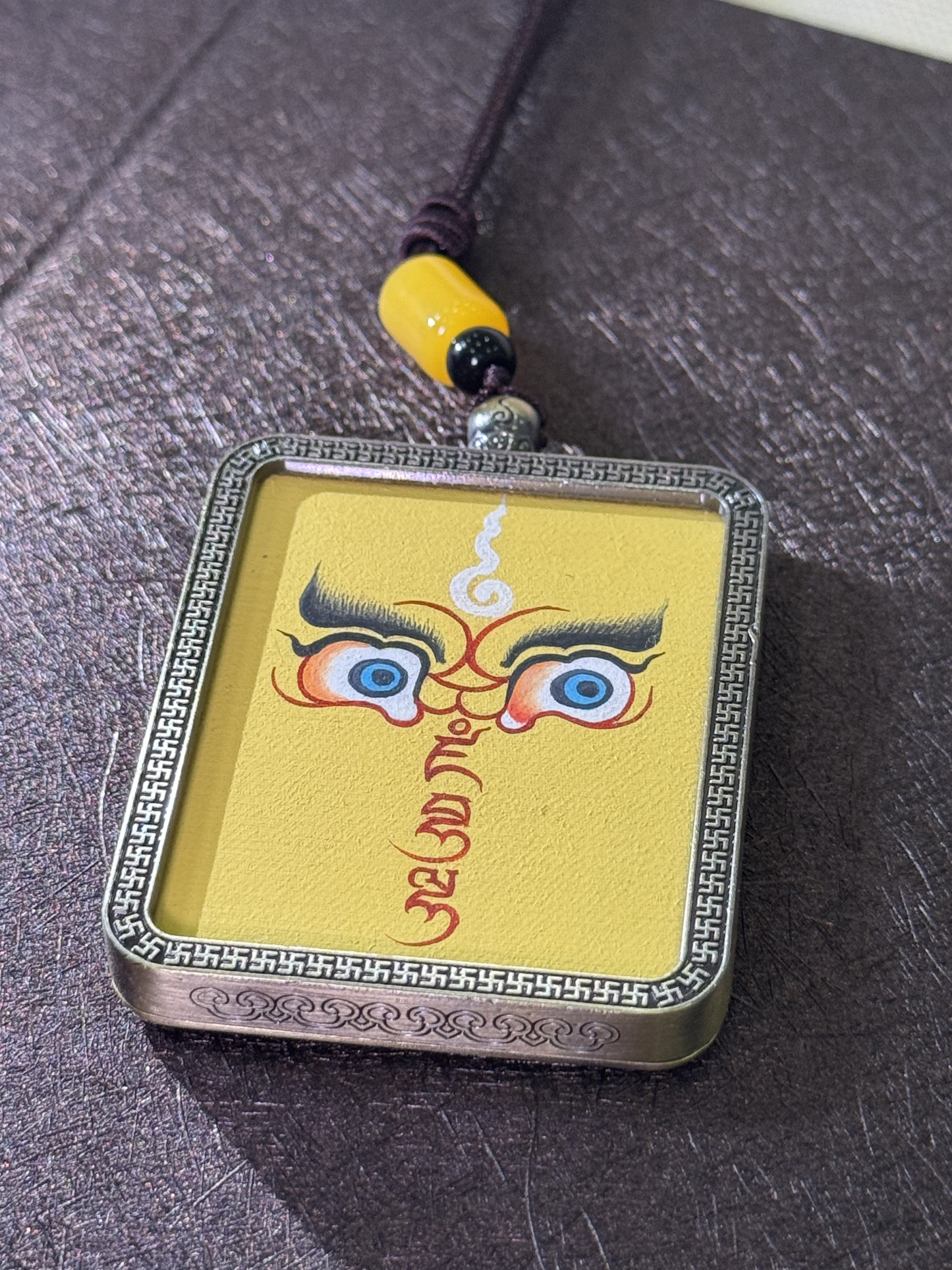 Yellow Jambhala Wisdom Eyes Thangka Pendant | Hand-Painted Guardian of Prosperity & Spiritual Insight